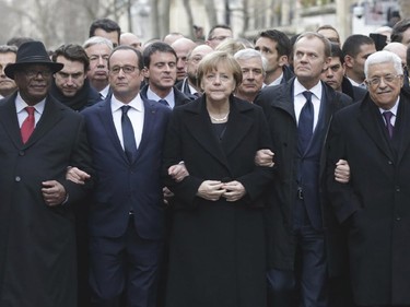 Malian President Ibrahim Boubacar Keita, French President Francois Hollande, German Chancellor Angela Merkel, EU president Donald Tusk and Palestinian Authority President Mahmoud Abbas march during a rally in Paris, France, Sunday, Jan. 11, 2015. A rally of defiance and sorrow, protected by an unparalleled level of security, on Sunday will honor the 17 victims of three days of bloodshed in Paris that left France on alert for more violence.