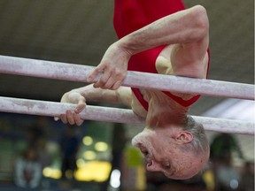 A participant of the German Gymnastics Festival competes on the parallel bars during the event's senior's championship on May 19, 2013 in Schwetzingen, western Germany.