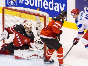 Zach Fucale (#31) of Canada makes a huge save against Pavel Buchnevich (#19) of Russia during the Gold medal game of the 2015 IIHF World Junior Championship on January 05, 2015 at the Air Canada Centre in Toronto, Ontario, Canada.