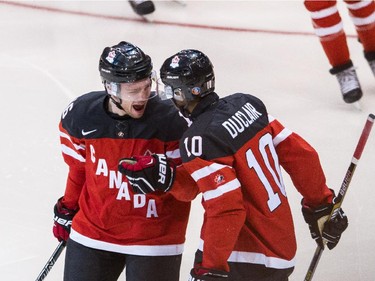 Max Domi (#16) and Anthony Duclair (#10) of Canada celebrate a goal against Russia during the Gold medal game of the 2015 IIHF World Junior Championship on January 05, 2015 at the Air Canada Centre in Toronto, Ontario, Canada.