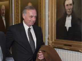Montreal Canadiens hockey legend Guy Lafleur leaves the courtroom for the lunch break in his lawsuit against the Montreal police and Quebec's attorney-general on Monday, January 12, 2015, in Montreal.