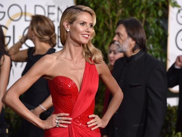 Heidi Klum arrives at the 72nd annual Golden Globe Awards at the Beverly Hilton Hotel on Sunday, Jan. 11, 2015, in Beverly Hills, Calif.