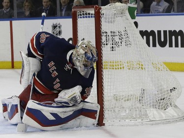 New York Rangers goalie Henrik Lundqvist watches the puck in his net after Montreal Canadiens left wing Max Pacioretty, scored during the third period of an NHL hockey game Thursday, Jan. 29, 2015 at Madison Square Garden in New York.  The Canadiens won 1-0.