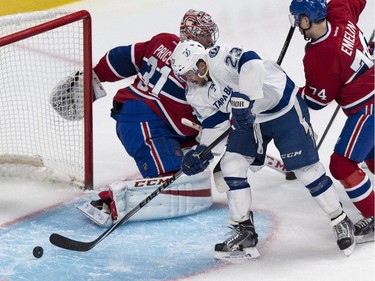 Tampa Bay Lightning's J.T. Brown scores past Montreal Canadiens goalie Carey Price during second period NHL hockey action Tuesday, January 6, 2015 in Montreal.