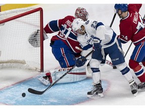 Tampa Bay Lightning's J.T. Brown scores past Montreal Canadiens goalie Carey Price during second period NHL hockey action Tuesday, January 6, 2015 in Montreal.