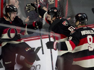 Ottawa Senators right wing Mark Stone (61) and Milan Michalek race to congratulate Jean-Gabriel Pageau on his first goal of the season during first-period action against the Montreal Canadiens Thursday, Jan. 15, 2015, in Ottawa.