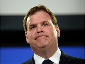 Minister of Foreign affairs John Baird holds a press conference at the National Press Theatre in Ottawa on Friday, Dec. 19, 2014.