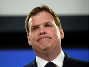 Foreign Affairs Minister John Baird holds a press conference at the National Press Theatre in Ottawa on Friday, Dec. 19, 2014. Baird has raised concerns with a Saudi prince about the flogging sentence handed down to a blogger with family in Quebec.