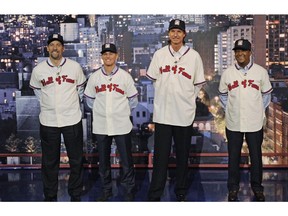 In this photo provided by CBS, the 2015 Baseball Hall of Fame inductees present the Top 10 "Things I Said When I Learned I Made the Baseball Hall of Fame," on the set of the Late Show with David Letterman on Jan. 7, 2015, in New York. From left are John Smoltz, Craig Biggio, Randy Johnson and Pedro Martinez.