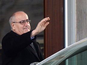 Associate Minister of Defence Julian Fantino waves as he leaves Rideau Hall in Ottawa on Monday, Jan. 5, 2015. In a quiet ceremony today at Rideau Hall, Fantino was replaced as veterans affairs minister by Erin O'Toole, a southern Ontario MP and former member of the Royal Canadian Air Force.