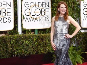 Julianne Moore arrives at the 72nd annual Golden Globe Awards at the Beverly Hilton Hotel on Sunday, Jan. 11, 2015, in Beverly Hills, Calif.