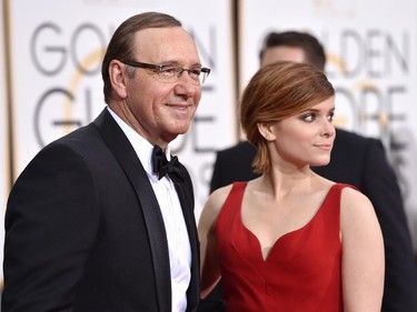 Kevin Spacey, left, and Kate Mara arrive at the 72nd annual Golden Globe Awards at the Beverly Hilton Hotel on Sunday, Jan. 11, 2015, in Beverly Hills, Calif.