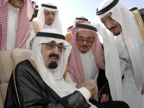 In this Monday, Nov. 22, 2010 file photo released by the Saudi Press Agency, Saudi Arabia's King Abdullah, left, speaks with Prince Salman, the Saudi King's brother and Riyadh governor, right, before the king's departure to United States, in Riyadh, Saudi Arabia. On early Friday, Jan. 23, 2015, Saudi state TV reported King Abdullah died at the age of 90.