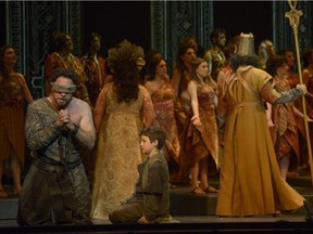 Samson ( Endrik Wottrich) kneels blind-folded  in Opéra de Montréal's Samson et Dalila.