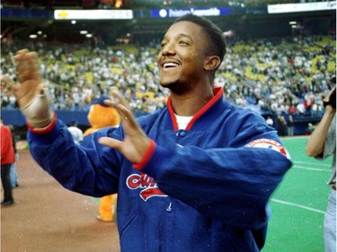 Montreal Expos pitcher Pedro Martinez waves goodbye to fans September 28, 1997 as it was all but certain he would not return to the team in the next season because the Expos couldn't afford to keep him.
