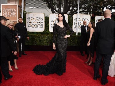 Laura Prepon arrives at the 72nd annual Golden Globe Awards at the Beverly Hilton Hotel on Sunday, Jan. 11, 2015, in Beverly Hills, Calif.