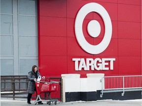 Laura Steele leaves a Target store after shopping in Toronto on Thursday, January 15, 2015.Target says it will close its stores in Canada‚ a market that it entered only two years ago.