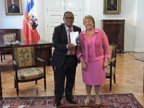 Luis Zuniga author of Ton Accent, Luis! and Chilean President Michelle Bachelet at La Moneda, the presidential palace in Santiago, Chile January 9, 2015.