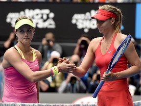 Russia's Maria Sharapova, right,  is congratulated by Westmount's Eugenie Bouchard at the net after winning their quarterfinal match at the Australian Open on Jan. 27, 2015.