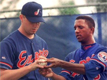 Mike Thurman gets pitching tips from starter Pedro Martinez at spring training camp in Florida Tuesday, February 25, 1997.