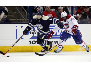 Columbus Blue Jackets' Matt Calvert, left, works for the puck against Montreal Canadiens' P.K. Subban during the second period of an NHL hockey game in Columbus, Ohio, Wednesday, Jan. 14, 2015.