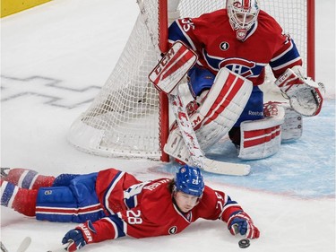 Defenceman Nathan Beaulieu attempts to block a shot by the New York Islanders as goalie Dustin Tokarsk looks on during the second period at the Bell Centre on Saturday, Jan. 17, 2015.