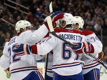 The Montreal Canadiens celebrate the game-winning third period goal by Max Pacioretty (#67) against the N.Y. Rangers  at Madison Square Garden on January 29, 2015 in New York City. The Canadiens shutout the Rangers 1-0.