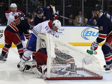Brendan Gallagher (#11) of the Montreal Canadiens hits into the net which topples over Henrik Lundqvist (#30) of the New York Rangers during the third period at Madison Square Garden on January 29, 2015 in New York City. The Canadiens shutout the Rangers 1-0.