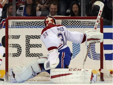 Carey Price (#31) of the Montreal Canadiens looks behind the net following a shot against the New York Rangers at Madison Square Garden on January 29, 2015 in New York City. The Canadiens shutout the Rangers 1-0.