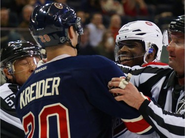 Chris Kreider (#20) of the New York Rangers speaks with P.K. Subban (#76) of the Montreal Canadiens during the first period at Madison Square Garden on January 29, 2015 in New York City.