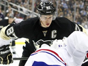 Penguins captain Sidney Crosby takes a faceoff against the Canadiens' 
David Desharnais during game at the Consol Energy Center in Pittsburgh on Jan. 22, 2014.