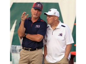 MONTREAL, QUE.: AUGUST 08, 2014 -- Montreal Alouettes coaching consultants Turk Schonert, left, and Don Matthews talk on the sidelines during Canadian Football League game against the Edmonton Eskimos in Montreal Friday August 08, 2014.   (John Mahoney  / THE GAZETTE) ORG XMIT: 50596-9280