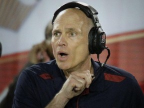 Alouettes head coach Tom Higgins watches the action during game against the Ottawa Red Blacks at Montreal's Molson Stadium on Aug. 29, 2014.