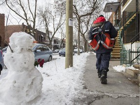 File photo: Canada Post mailman delivering mail in Villeray–Saint-Michel–Parc-Extension borough