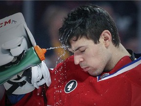 Canadiens goalie Carey Price sprays water in his face before game against the Los Angeles Kings at the Bell Centre on Dec. 12, 2014.
