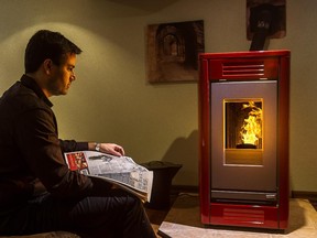 Jean-François Fauteux, president of La Maison D. F., sells wood stoves like the Piazzetta SY pellet burning wood stove in his basement in Chambly.