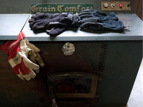 Gloves dry on a wood fired stove at the Quinn Farm,  pictured in Montreal on Sunday, December 9, 2012.