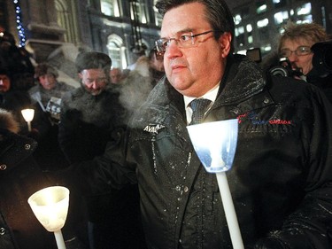 Montreal Mayor Denis Coderre braved the cold during a vigil organized by Montreal City Hall on Wednesday night in support of the victims of the terrorist attack in Paris. A large banner saying Je suis Charlie was installed at the top of the city hall in memory of Charlie Hebdo's victims.
