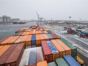Shipping containers aboard the Valencia Express ship docked at the Port of Montreal on on Jan. 1, 2015.