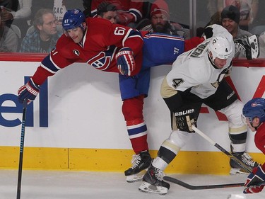 MONTREAL, QUE.: JANUARY  10, 2015 -- Montreal Canadiens left wing Max Pacioretty goes into boards has he tries to keep control of puck as Pittsburgh Penguins' Rob Scuderi slides in, during first period NHL action in Montreal on Saturday January 10, 2015. (Pierre Obendrauf / MONTREAL GAZETTE)