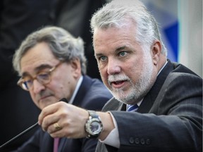 Quebec Premier Philippe Couillard, right, and Michael Sabia, President and CEO of the Caisse de depot et placement du Quebec at announcement of an infrastructure partnership between the Caisse and the Quebec government, at the Caisse's headquarters in Montreal Tuesday January 13, 2015.