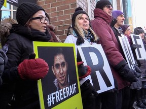 Supporters of Raif Badawi, including Badawi's wife, Ensaf Haidar, left, demonstrated outside Complexe Desjardins in Montreal, on Tuesday, January 13, 2015 for the release of Badawi, a 30-year-old Saudi Arabian blogger who was convicted last May of insulting Islam in his blog, and sentenced to 10 years in prison and 1,000 lashes.