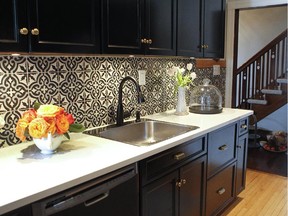 In her own kitchen, Vanessa Sicotte stained the maple cabinets and chose Moorish-style tiles that were so heavy, that they had to be glued in place one at a time.