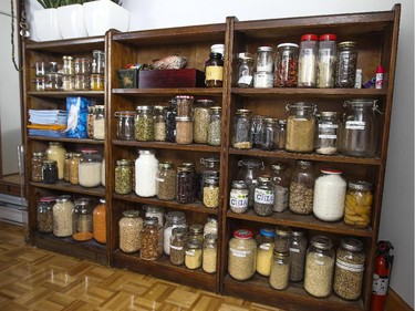 Labelled mason jars on shelves just outside the kitchen.