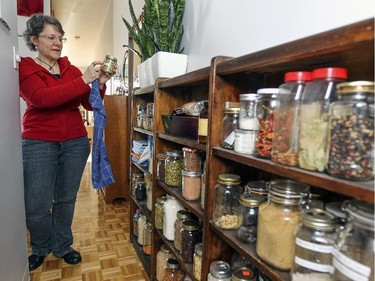 Labelled mason jars on shelves just outside the kitchen in Alison Lush's apartment.