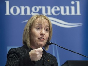 Longueuil mayor Caroline St-Hilaire answers question from reporters on Thursday January 15, 2015.