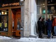 Customers stand outside Divan Orange in Montreal Jan. 16, 2015. The club held a Levée de Son fundraiser after neighbours complained about the noise.