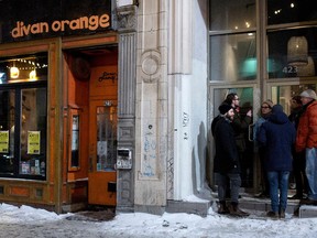 Customers stand outside Divan Orange in Montreal Jan. 16, 2015. The club held a Levée de Son fundraiser after neighbours complained about the noise.