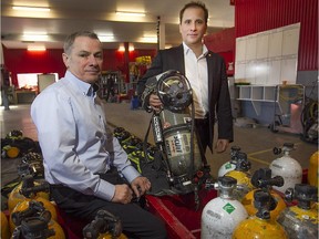 Martin Ruel, right, vice-president and Bernard Bélair, president of Targe Risk Management in Mirabel on Friday January 16, 2015, with part of training equipment inside their training facility. Targe Risk Management, runs emergency management and disaster training programs.