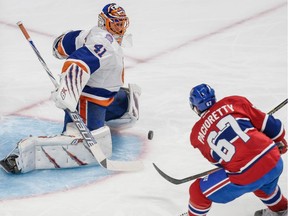 New York Islanders goalie Jaroslav Halak makes save on the Canadiens' Max Pacioretty during game at the Bell Centre on Jan. 17, 2015.
